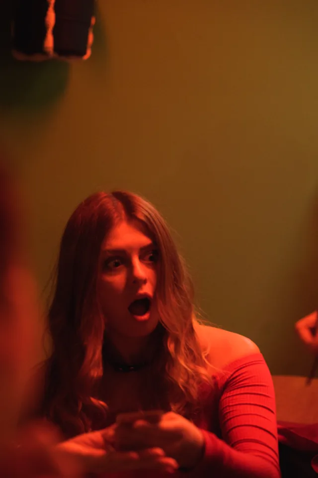 An audience member reacting with surprise during a performance