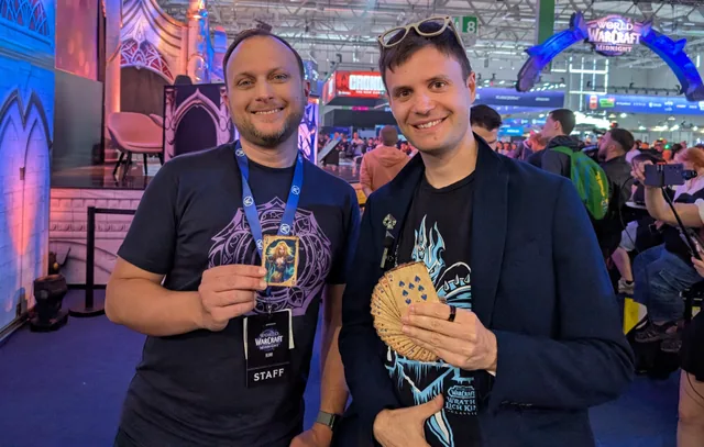 Neven with Ion Hazzikostas holding Warcraft playing cards